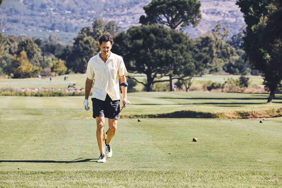 Golfer walking the course